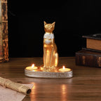 Statue and candlestick of the Egyptian cat goddess Bastet.