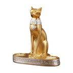 Statue and candlestick of the Egyptian cat goddess Bastet.