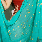 Coleção Nomad Sari Mediterrâneo - Pareô - Desenho de peixes em turquesa e dourado